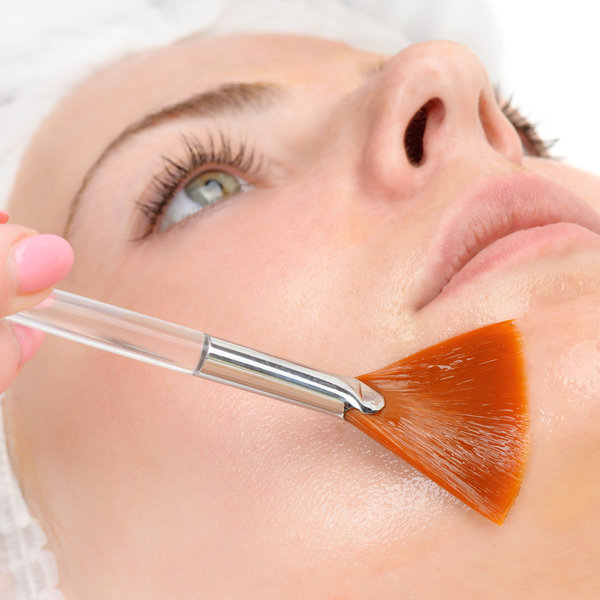 Professional skin peel being applied